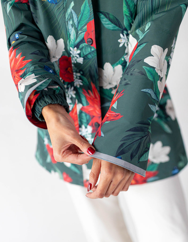 Jardin Scribbler mesh-lined rain jacket, green botanical floral print, raincoat, colourful printed hooded rain wear, waterproof jacket for women, lightweight, plus size raincoat, New Zealand design, PFA free, recycled plastic fabrics. Reflective elements.