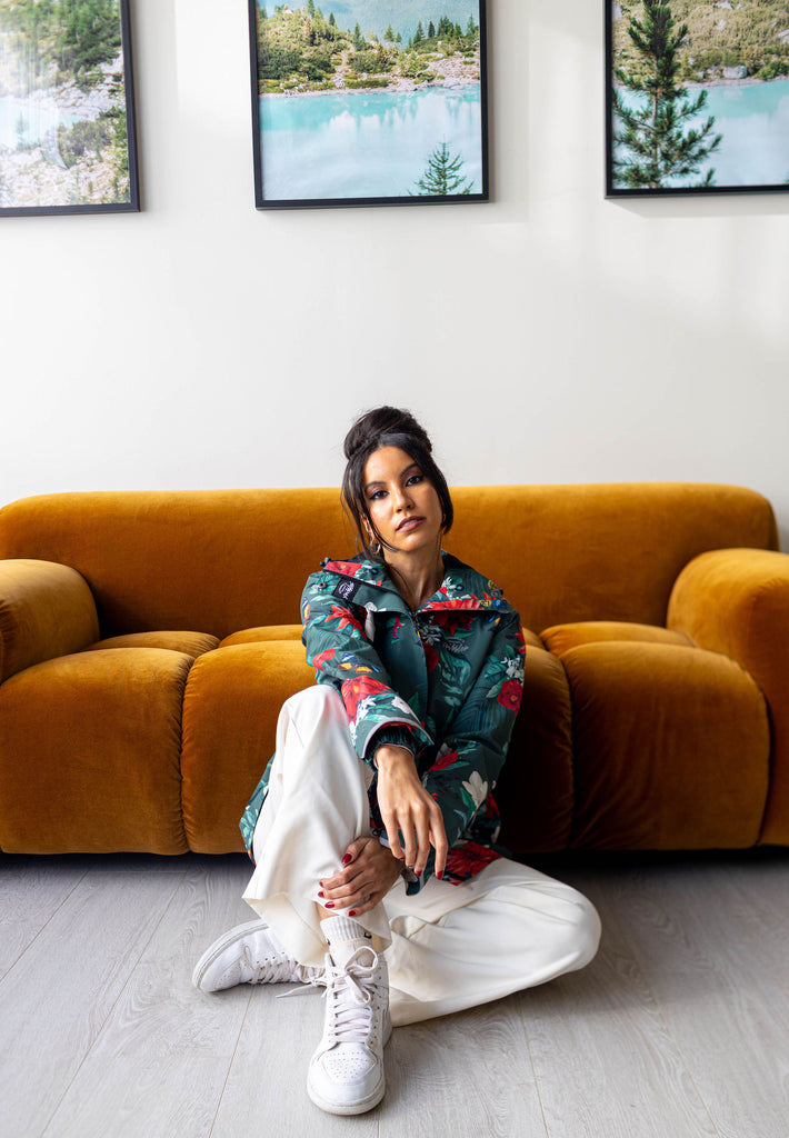 Jardin Scribbler mesh-lined rain jacket, green botanical floral print, raincoat, colourful printed hooded rain wear, waterproof jacket for women, lightweight, plus size raincoat, New Zealand design, PFA free, recycled plastic fabrics.