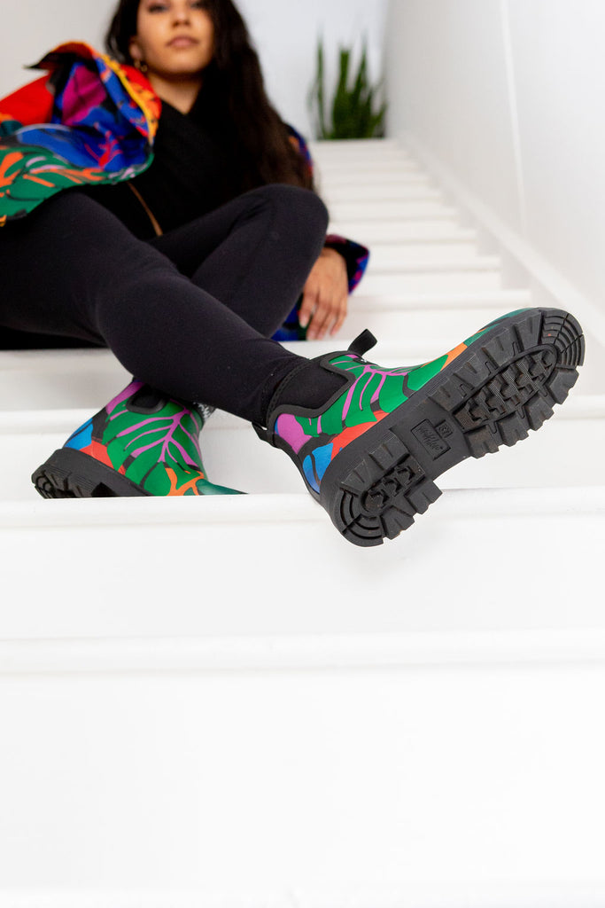 Scribbler rain boots, waterproof ankle gumboots for women, rain wellies for ladies, outerwear, waterproof, natural rubber boots, lightweight, neoprene lining, sustainable fashion, winter boots, tropical Carnaval printed Chelsea boots, carnival print, camping boots, stylish boots, colourful printed boots, best ankle gum boots, NZ design, New Zealand designer, handmade, mustard yellow, pink, blue, green, slip-on