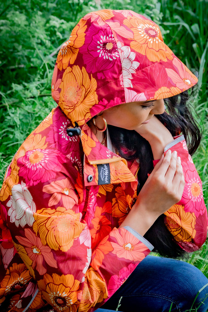 Solar, Scribbler floral rain jacket, yellow rain jacket, pink, orange, white flowers, raincoat, waterproof, plus sizes, New Zealand design, recycled plastic, sustainable fashion, rain gear, outdoor wear for women, rain jacket