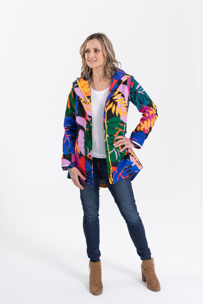 Scribbler rainwear, waterproof raincoat for women, rain jacket for ladies, outerwear, waterproof, mesh lined, lightweight, recycled plastic, sustainable fashion, winter coat, tropical Carnaval print, carnival print, mesh lined, beautiful, colourful print, breathable, packable coat, NZ, New Zealand designer, plus size, curvy, curves, mustard yellow, pink, blue, green