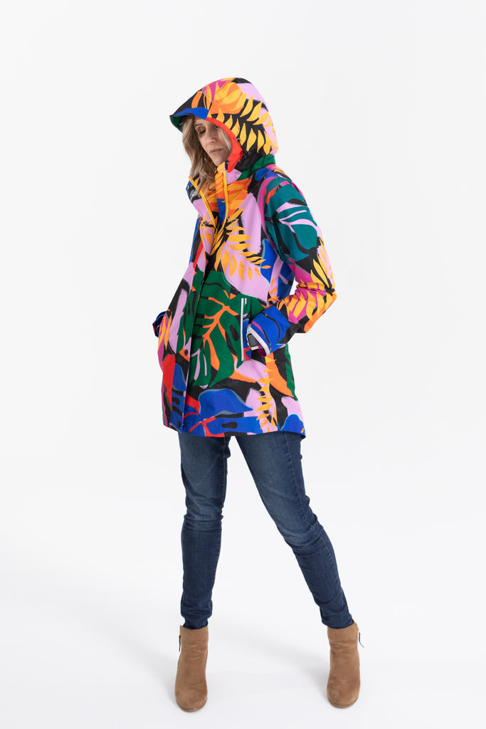 Scribbler rainwear, waterproof raincoat for women, rain jacket for ladies, outerwear, waterproof, mesh lined, lightweight, recycled plastic, sustainable fashion, winter coat, tropical Carnaval print, carnival print, mesh lined, beautiful, colourful print, breathable, packable coat, NZ, New Zealand designer, plus size, curvy, curves, mustard yellow, pink, blue, green