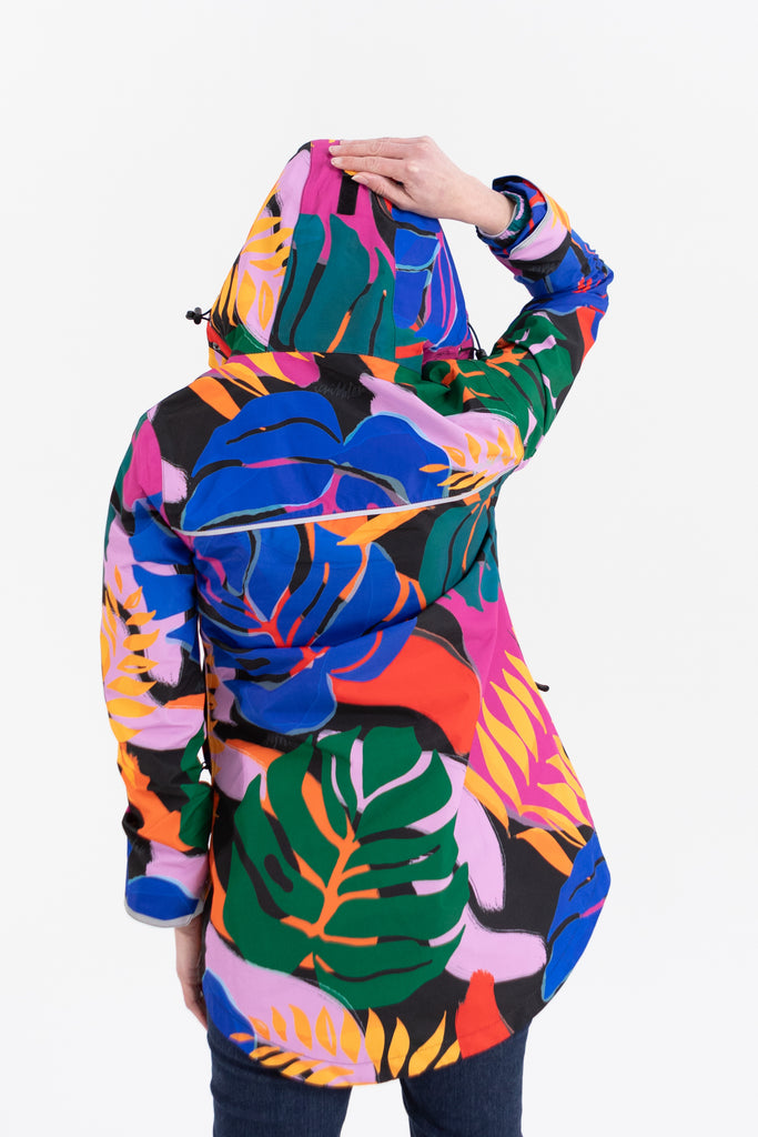 Scribbler rainwear, waterproof raincoat for women, rain jacket for ladies, outerwear, waterproof, mesh lined, lightweight, recycled plastic, sustainable fashion, winter coat, tropical Carnaval print, carnival print, mesh lined, beautiful, colourful print, breathable, packable coat, NZ, New Zealand designer, plus size, curvy, curves, mustard yellow, pink, blue, green