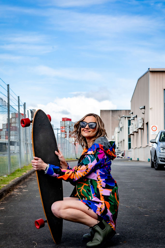 Scribbler rainwear, waterproof raincoat for women, rain jacket for ladies, outerwear, waterproof, mesh lined, lightweight, recycled plastic, sustainable fashion, winter coat, tropical Carnaval print, carnival print, mesh lined, beautiful, colourful print, breathable, packable coat, NZ, New Zealand designer, plus size, curvy, curves, mustard yellow, pink, blue, green