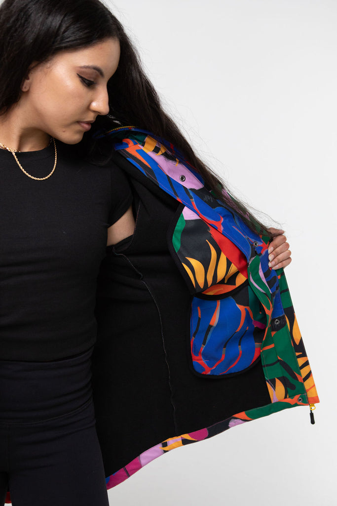 Carnaval fleece bonded womens waterproof raincoat, yellow, mustard, cobalt blue, magenta pink, plus size, NZ design, rain jacket, waterproof parka, winter coat, travel, wind proof, Scribbler, floral coat, USA winter coat, Canada waterproof winter parka, carinval print, colourful rain jacket, colourful raincoat, colourful coat, tropical