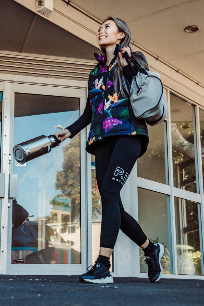 Scribbler paradiso vest, tropical print, black colourful puffer vest, waterproof gilet, recycled fabric, recycled puffer, conscious fashion, plus size vest, floral vest, removable hood, tropical print, printed vest, colourful vest, black puffer vest, quilted vest, plus size vest, NZ, New Zealand, Australia, USA