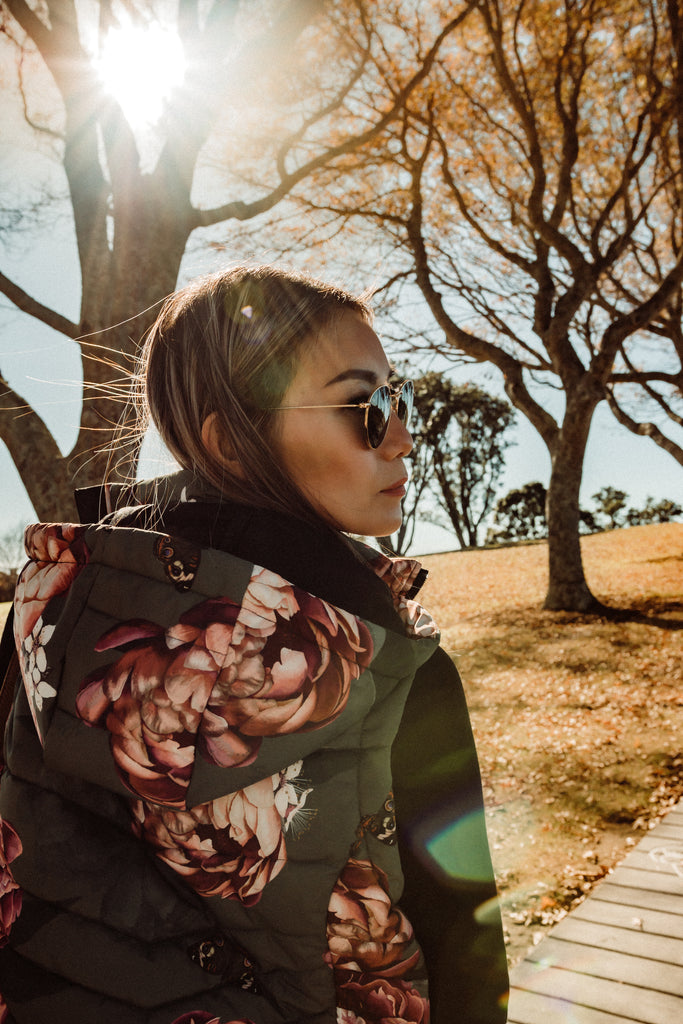 Scribbler waterproof puffer vest, Military Peony print, green puffer vest, waterproof gilet, recycled fabric, recycled puffer, conscious fashion, plus size vest, floral vest, removable hood, botanical print, printed vest, colourful vest, quilted vest, plus size vest