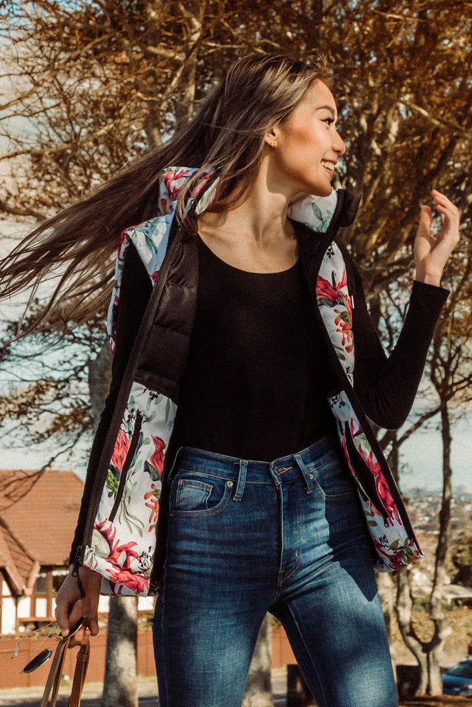 Scribbler protea vest, African protea print, White puffer vest, waterproof gilet, recycled fabric, recycled puffer, conscious fashion, plus size vest, floral vest, removable hood, botanical print, quilted vest, plus size vest, NZ, New Zealand, Australia, USA