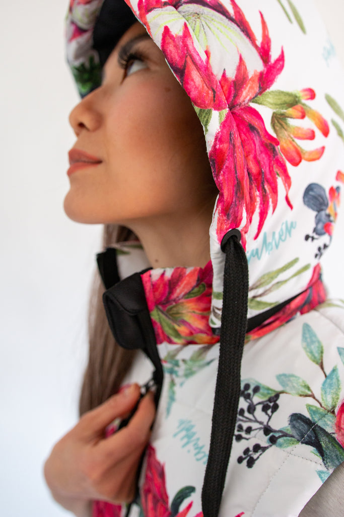 Scribbler protea vest, African protea print, White puffer vest, waterproof gilet, recycled fabric, recycled puffer, conscious fashion, plus size vest, floral vest, removable hood, botanical print, quilted vest, plus size vest, NZ, New Zealand, Australia, USA