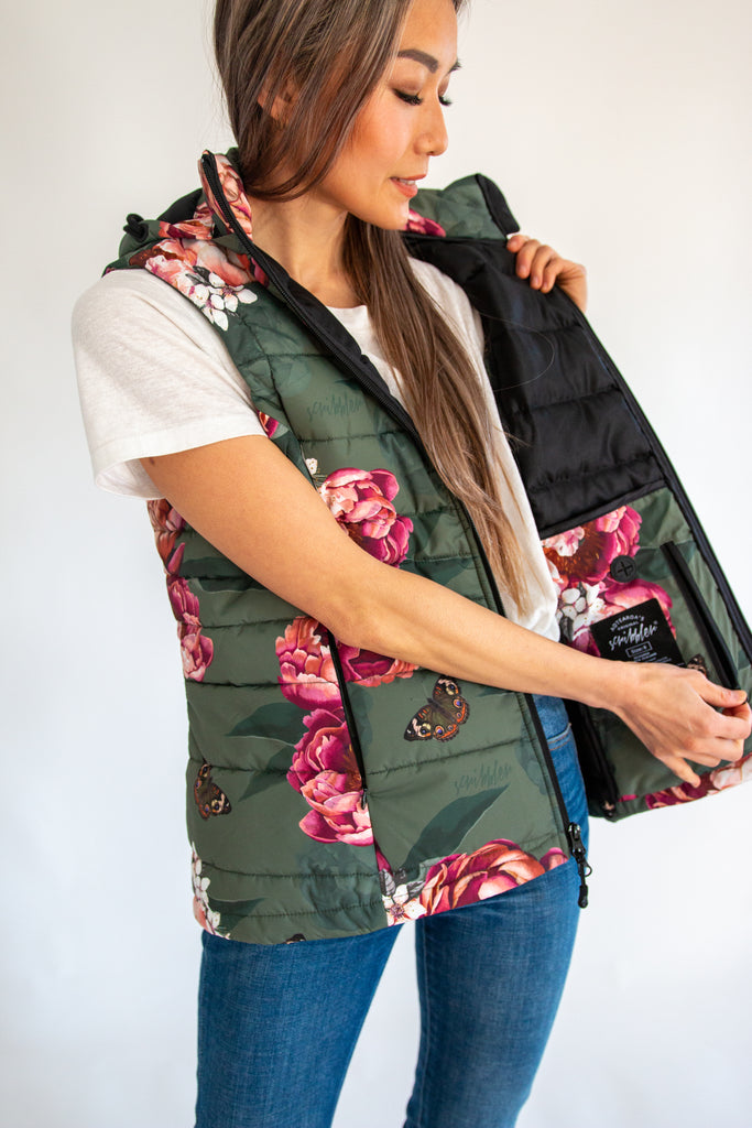 Scribbler waterproof puffer vest, Military Peony print, green puffer vest, waterproof gilet, recycled fabric, recycled puffer, conscious fashion, plus size vest, floral vest, removable hood, botanical print, printed vest, colourful vest, quilted vest, plus size vest, plus size, NZ, New Zealand, Australia, USA