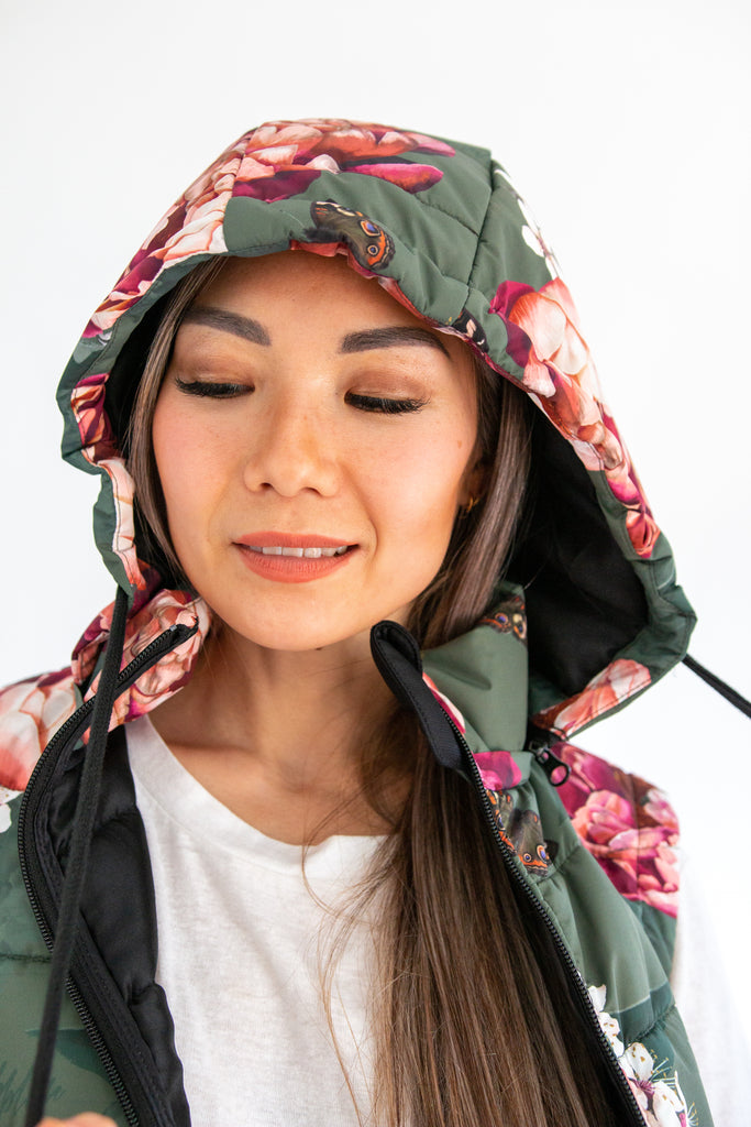 Scribbler waterproof puffer vest, Military Peony print, green puffer vest, waterproof gilet, recycled fabric, recycled puffer, conscious fashion, plus size vest, floral vest, removable hood, botanical print, printed vest, colourful vest, quilted vest, plus size vest, plus size, NZ, New Zealand, Australia, USA