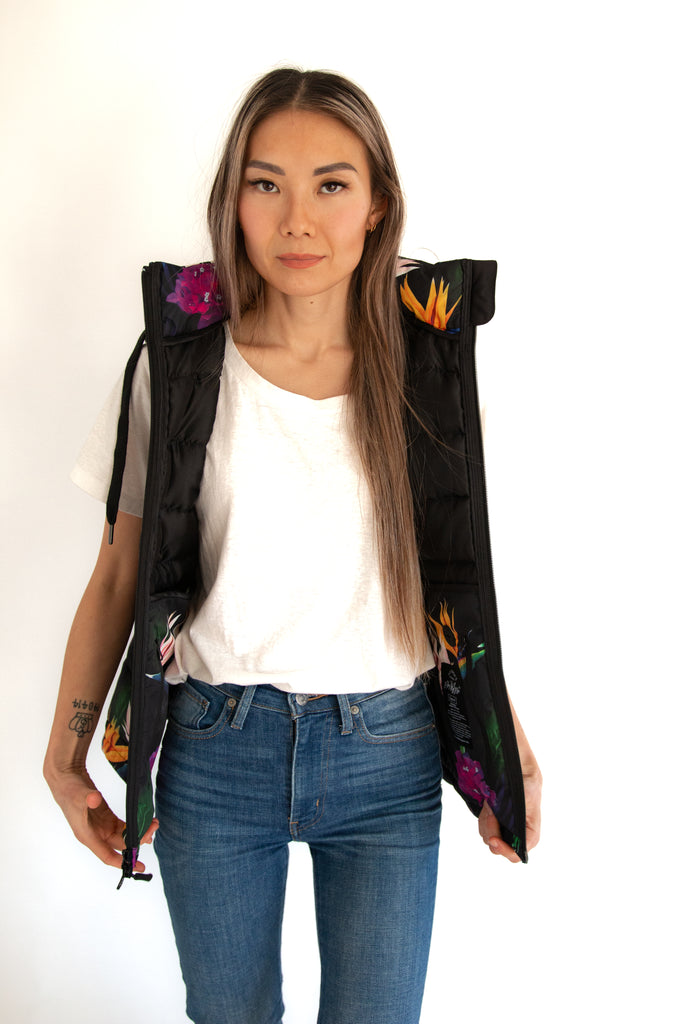Scribbler paradiso vest, tropical print, black colourful puffer vest, waterproof gilet, recycled fabric, recycled puffer, conscious fashion, plus size vest, floral vest, removable hood, tropical print, printed vest, colourful vest, black puffer vest, quilted vest, plus size vest, NZ, New Zealand, Australia, USA