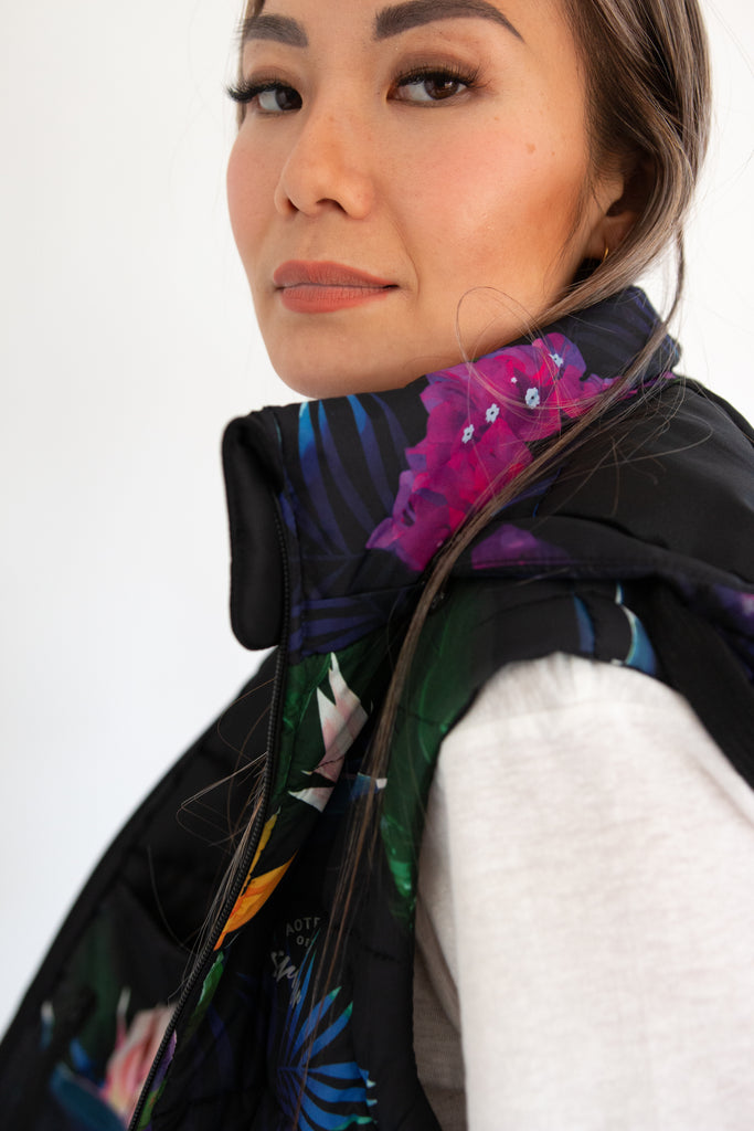 Scribbler paradiso vest, tropical print, black colourful puffer vest, waterproof gilet, recycled fabric, recycled puffer, conscious fashion, plus size vest, floral vest, removable hood, tropical print, printed vest, colourful vest, black puffer vest, quilted vest, plus size vest, NZ, New Zealand, Australia, USA
