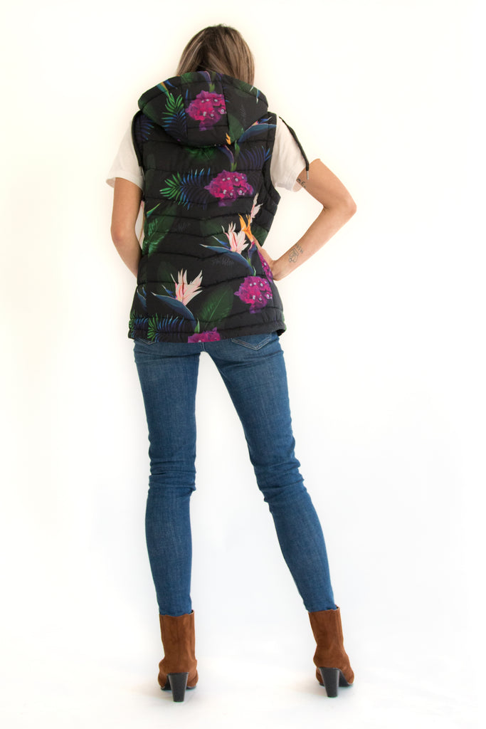 Scribbler paradiso vest, tropical print, black colourful puffer vest, waterproof gilet, recycled fabric, recycled puffer, conscious fashion, plus size vest, floral vest, removable hood, tropical print, printed vest, colourful vest, black puffer vest, quilted vest, plus size vest, NZ, New Zealand, Australia, USA