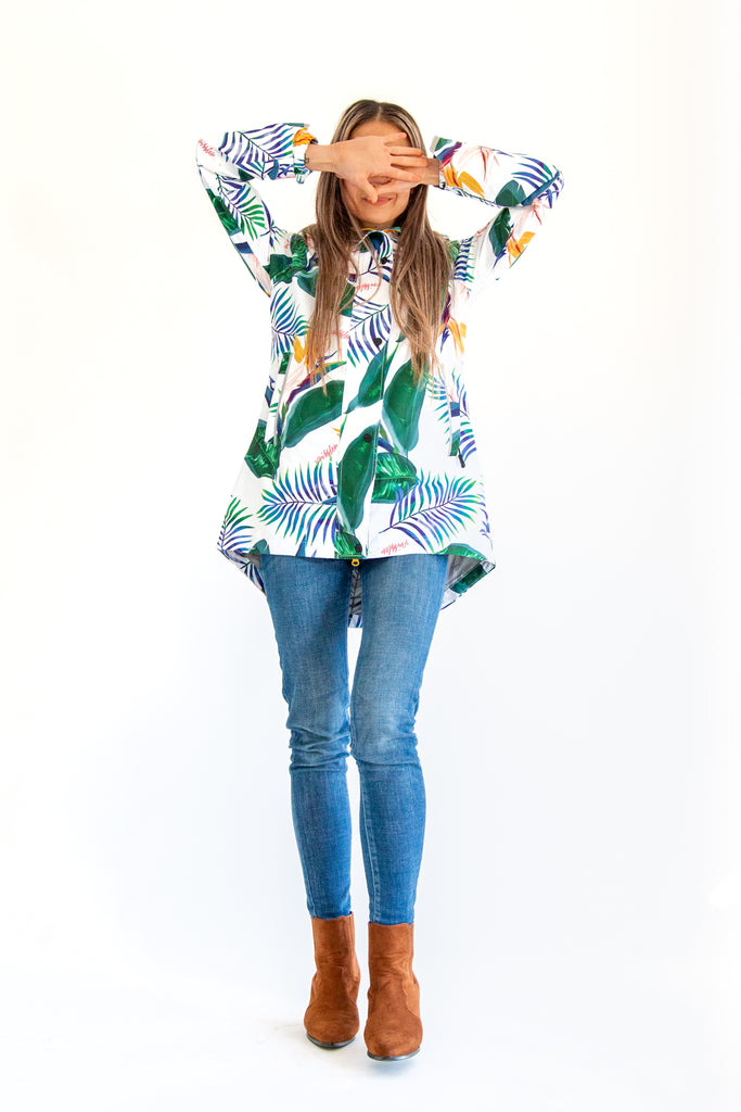 Scribbler rainwear, waterproof raincoat for women, rain jacket for ladies, outerwear, waterproof, mesh lined, lightweight, recycled plastic, sustainable fashion, winter coat, tropical Tropic print, mesh lined, beautiful, colourful print, breathable, packable coat, NZ, New Zealand designer, plus size, curvy, curves, white, green leaves, strelitzia, colourful rain jacket