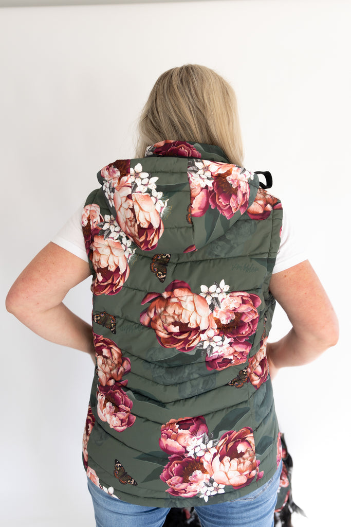 Scribbler waterproof puffer vest, Military Peony print, green puffer vest, waterproof gilet, recycled fabric, recycled puffer, conscious fashion, plus size vest, floral vest, removable hood, botanical print, printed vest, colourful vest, quilted vest, plus size vest, plus size, NZ, New Zealand, Australia, USA