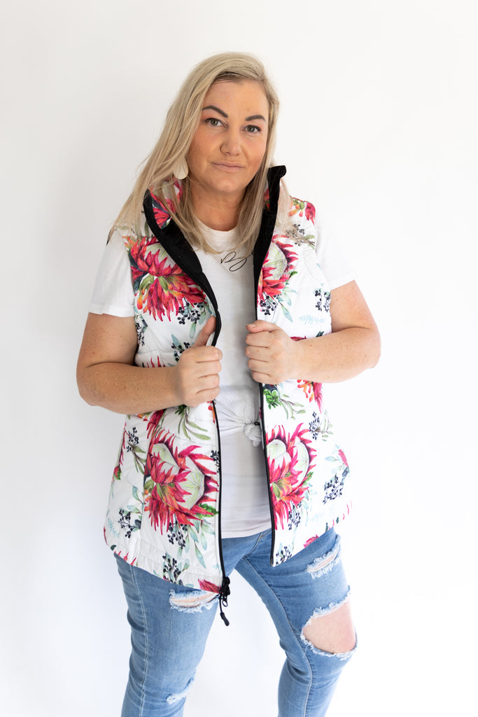 Scribbler protea vest, African protea print, White puffer vest, waterproof gilet, recycled fabric, recycled puffer, conscious fashion, plus size vest, floral vest, removable hood, botanical print, quilted vest, plus size vest, NZ, New Zealand, Australia, USA