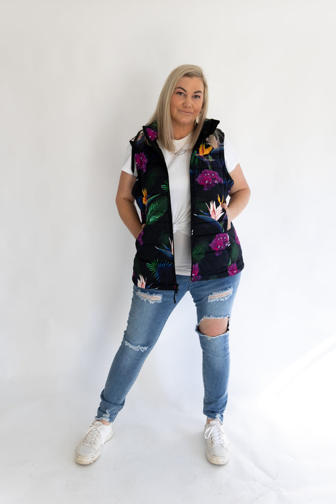 Scribbler paradiso vest, tropical print, black colourful puffer vest, waterproof gilet, recycled fabric, recycled puffer, conscious fashion, plus size vest, floral vest, removable hood, tropical print, printed vest, colourful vest, black puffer vest, quilted vest, plus size vest, NZ, New Zealand, Australia, USA